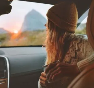 Woman in a car on road trip