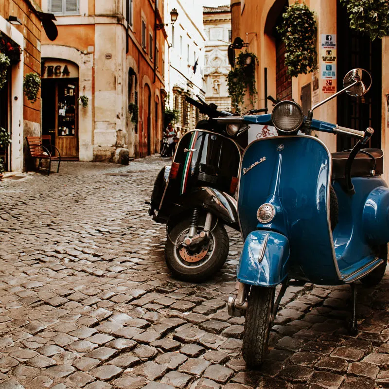 scooters in rome italy alleyway