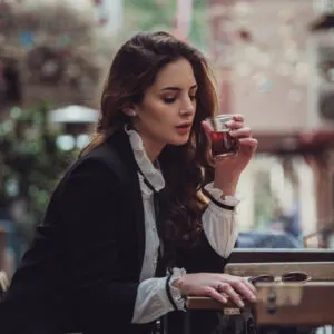 woman drinking turkish tea in cafe