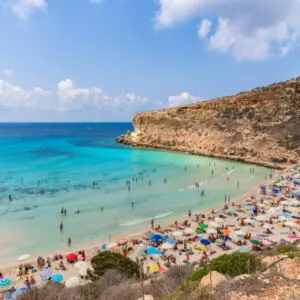 Isola dei Conigli (Rabbit Island) and its beautiful beach with turquoise sea water. Lampedusa, Sicily, Italy.