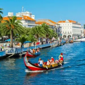 Traditional Barcos Moliceiros, Or Portuguese Gondolas, Traveling Up The Main Canal In Aveiro, A Venice-Style City In Northern Portugal, Iberia, Southern Europe