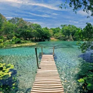 A Wooden Pier Stretching Out Onto A Crystal Clear Lagoon Near Diamantina, In The State Of Minas Gerais, Brazil, South America, Latin America