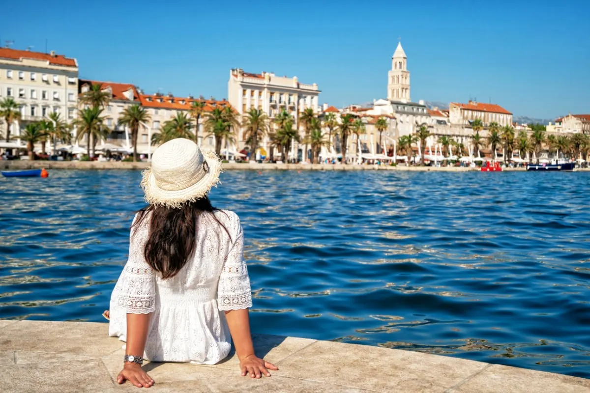 Woman traveler travel to old town of Split in Dalmatia, Croatia. Split is the famous city and top tourism destination of Croatia and Europe