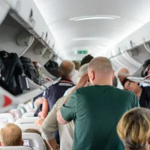 passengers-boarding-a-crowded-plane - Travel Off Path