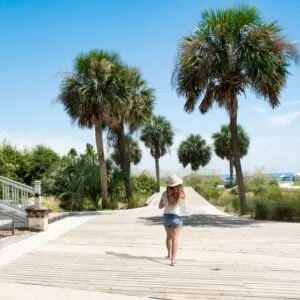 woman walking along beach in hilton head
