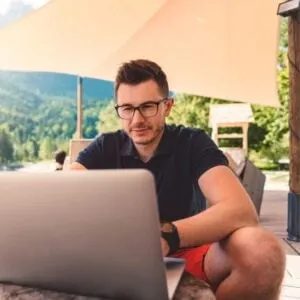 Man Using Laptop Outside