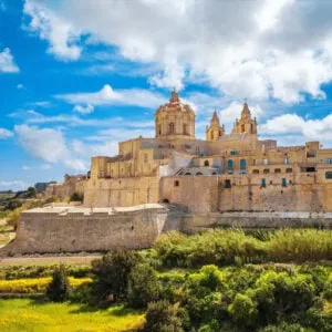 The Walled Medieval City Of Mdina Seen From The Open Fields Beneath The Citadel, Malta, An Island Nation In The Mediterranean Sea, Southern Europe