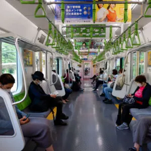 Train passengers maintaining social distance