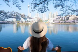 Tourist in front of Lotte World Tower in Seoul South Korea trending asian capital