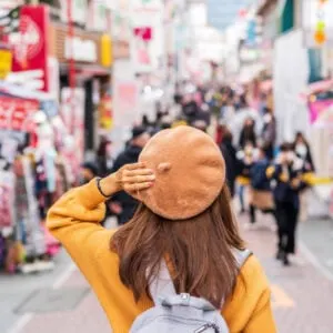 Woman walking on the Takeshita street, Tokyo, Japan