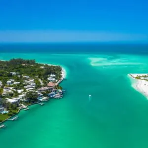 C:\Users\kmari\Pictures\top\greenish blue ocean water with homes on the side