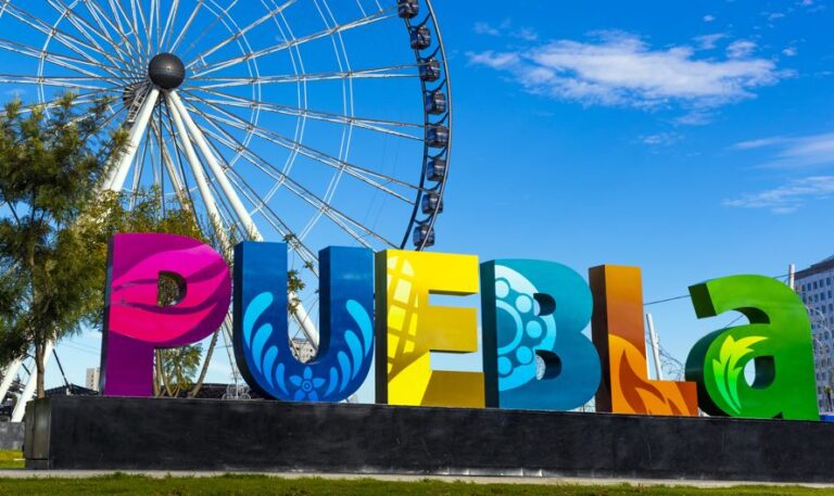 puebla sign with ferris wheel - Travel Off Path