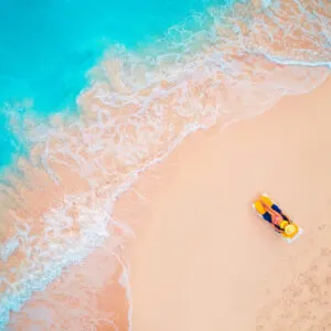 woman on beach with blue water Dominican Republic