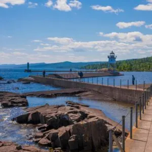 walk way over the lake leading to a lighthouse