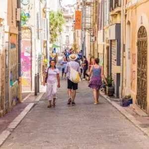 A Busy Narrow Street In Old Town Marseille, Southern Coast Of France, Mediterranean Europe