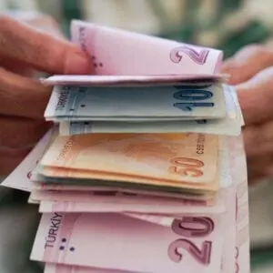 A Person Counting Turkish Lira Notes, The National Currency Of Turkiye