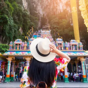 A woman tourist is sightseeing at Batu Caves in Kuala Lumpur, Malaysia. copy
