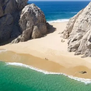 Aerial Image of couple standing on Playa de los Almantes in Cabo San Lucas, Baja California, Mexico