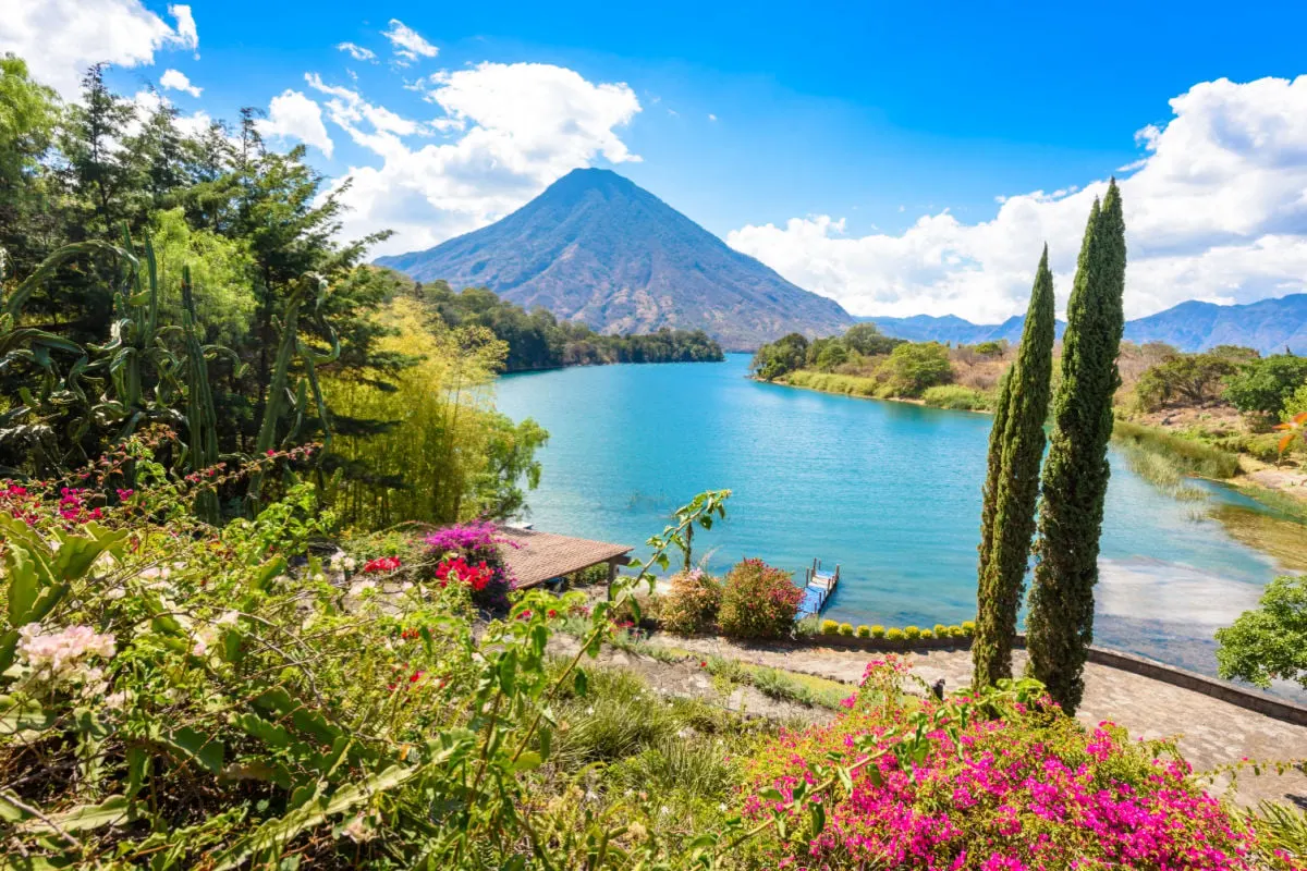 Beautiful bay of Lake Atitlan with view to Volcano San Pedro in highlands of Guatemala, Central America