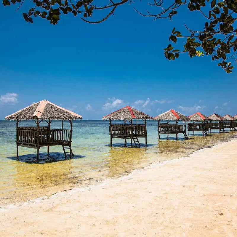 Huts Along The Shoreline In Palawan, Philippines, Southeast Asia