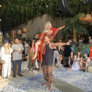 Man holding a woman in Tulum party