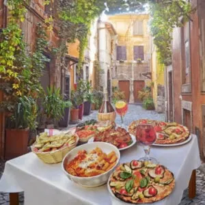 dinner table with traditional Italian food in Rome