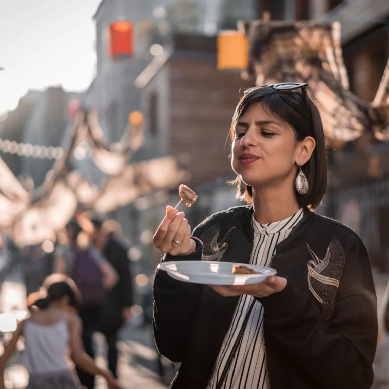 Woman eating street food in Paris