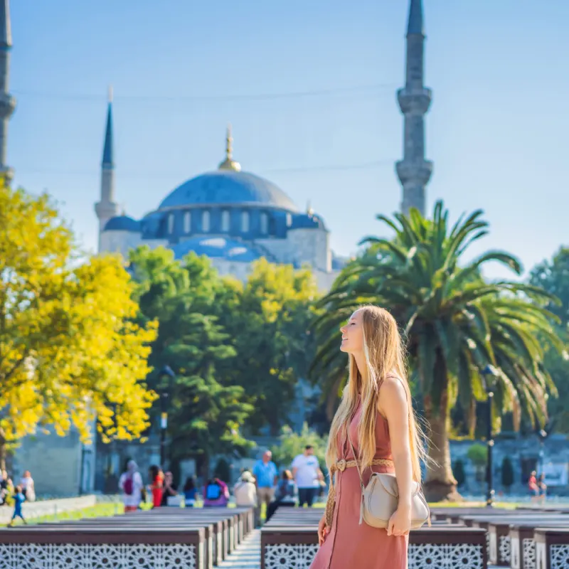 Woman tourist enjoying the view Blue Mosque, Sultanahmet Camii, Istanbul, Turkey