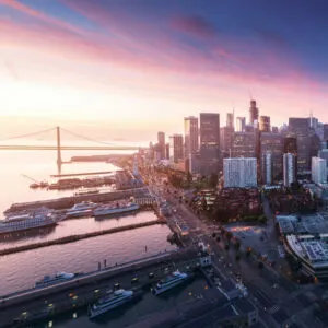 aerial view of the san francisco city skyline with golden gate bridge at dusk