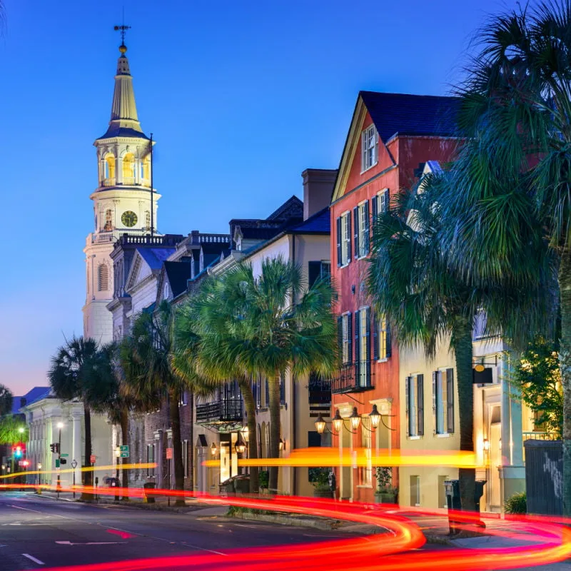 the french quarter of downtown charleston south carolina at night with light trails