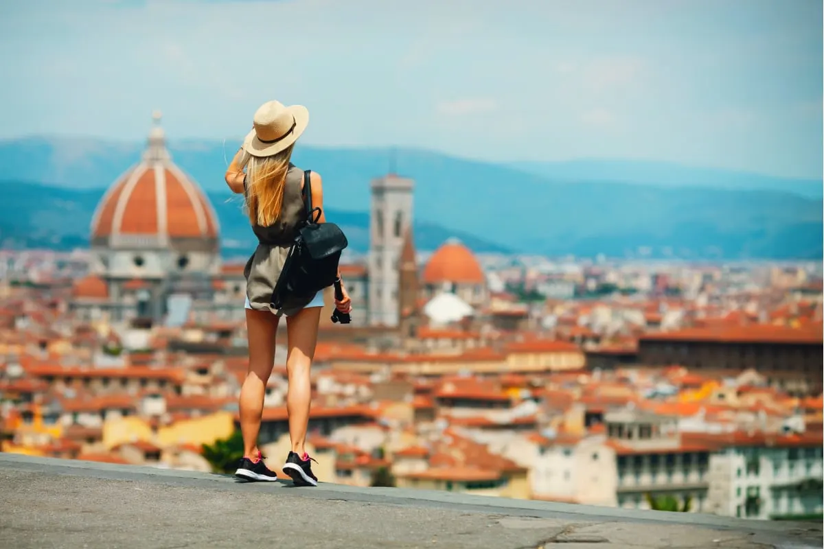 Woman overlooking a city in Europe