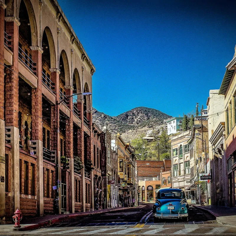 Classic car driving through Bisbee, Arizona