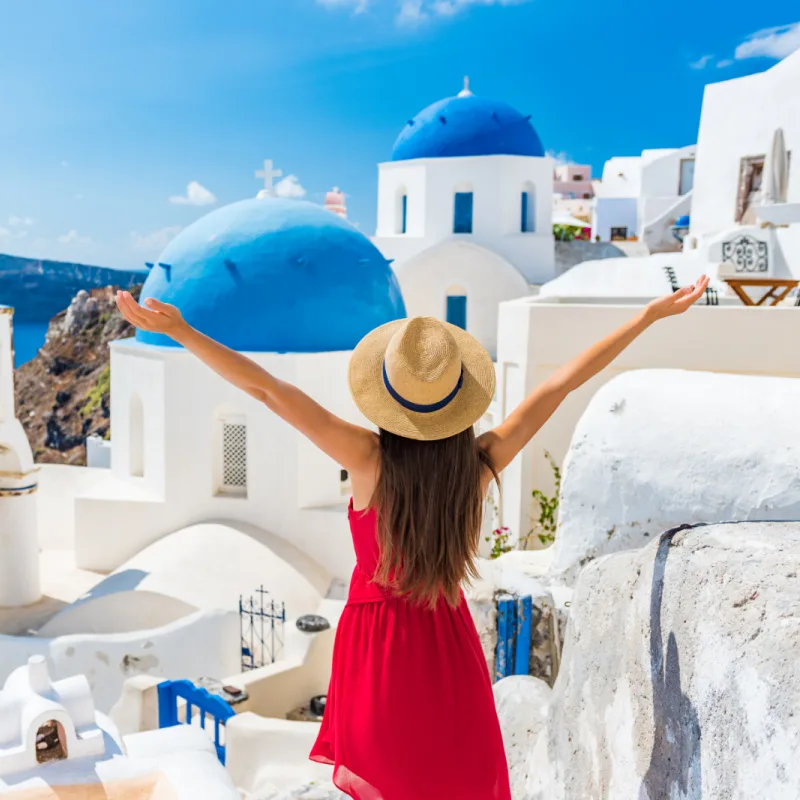 Happy woman in Santorini, Greece