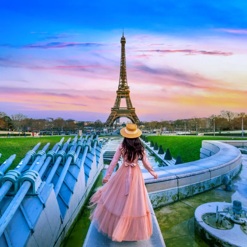Woman in Paris, France, looking at the Eiffel Tower