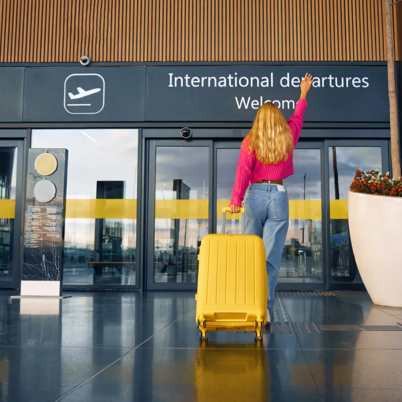 Female traveler entering international terminal