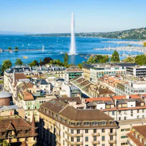Panoramic View Of Geneva Old Town With The Jet d'Eau Seen In The Background In Lake Geneva, Switzerland, Central Europe.jpg