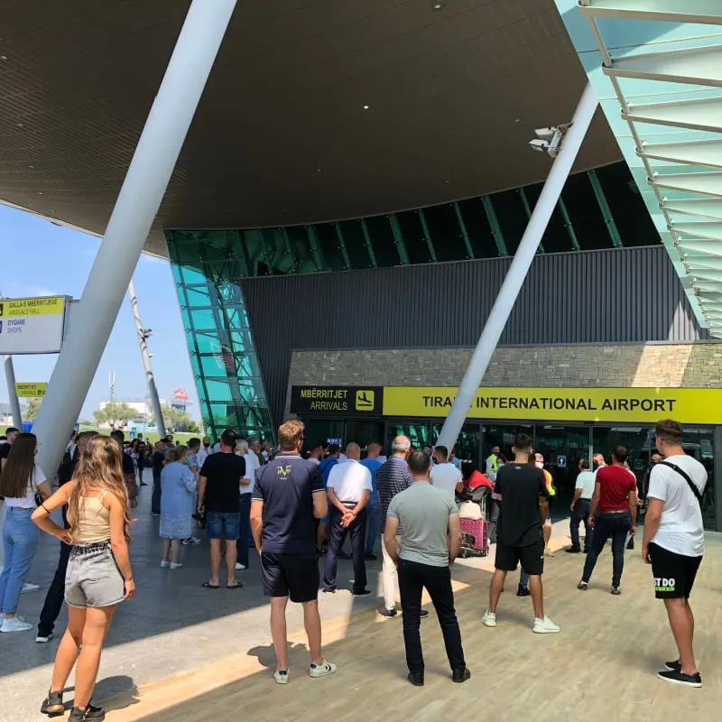 People standing outside of Tirana airport