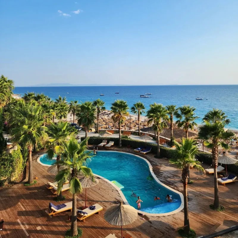 Pool at beachfront hotel in Dhermi