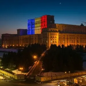 Romanian Parliament Pictured At Night With The Romanian Tricolor Flag Displayed In The Highest Tower, Bucharest, Romania, Eastern Europe