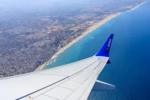 FlyDubai plane flying over ocean
