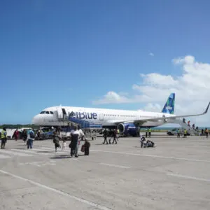 Passengers coming out of a JetBlue plane