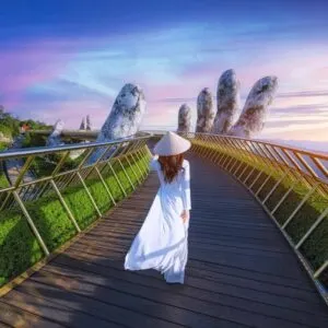 Young Female Tourist Walking The Hand Bridge In Vietnam, Southeast Asia