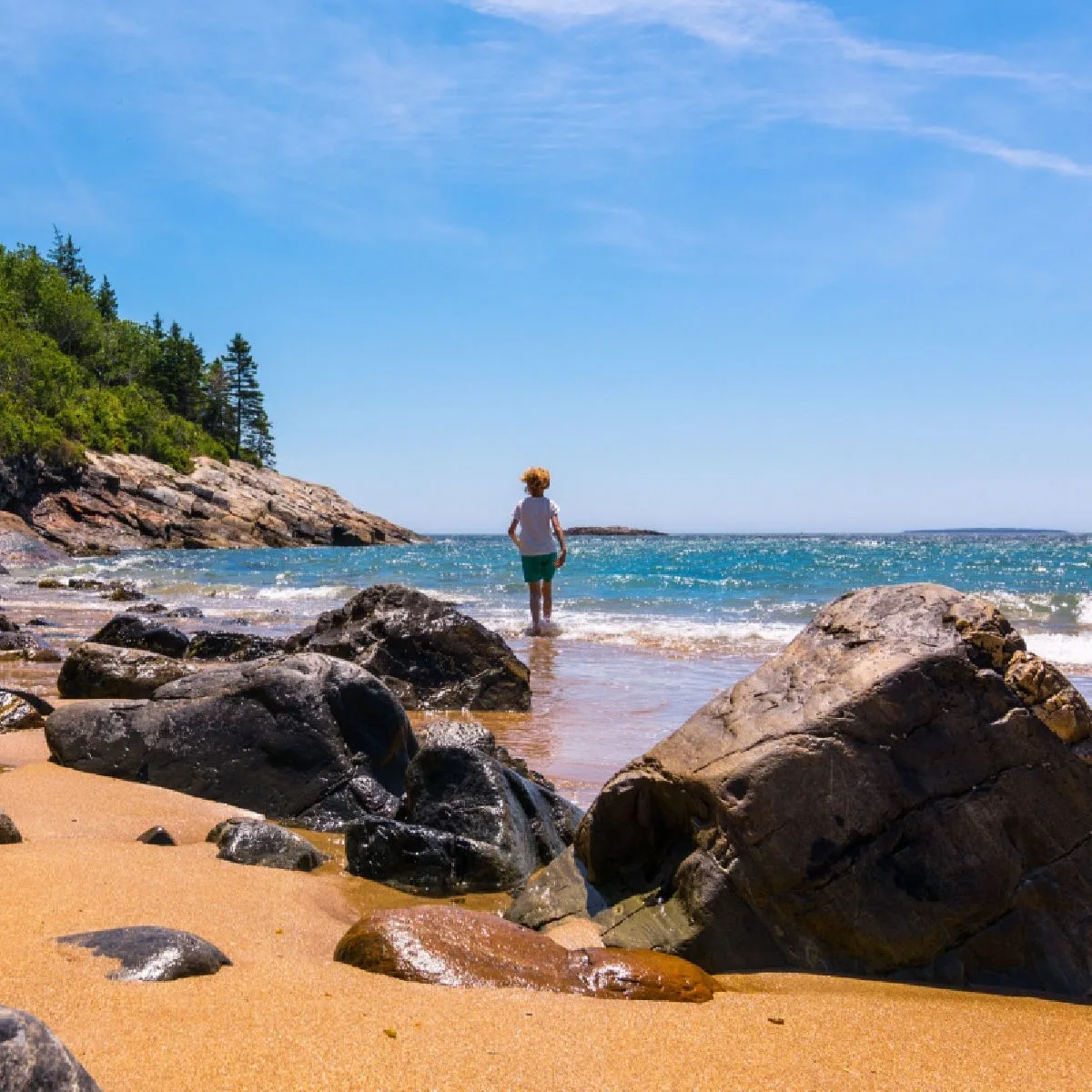 Person walking into water, Sand Beach, Acadia National Park