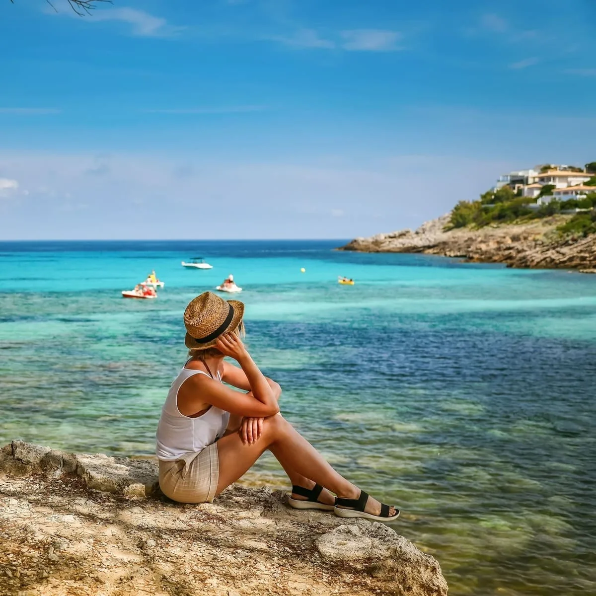 Young Woman Admiring A View Of The Mediterranean Sea In Mallorca, Spain