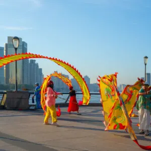 People are practicing ribbon dragon dance in the morning at the Bund in Shanghai, China