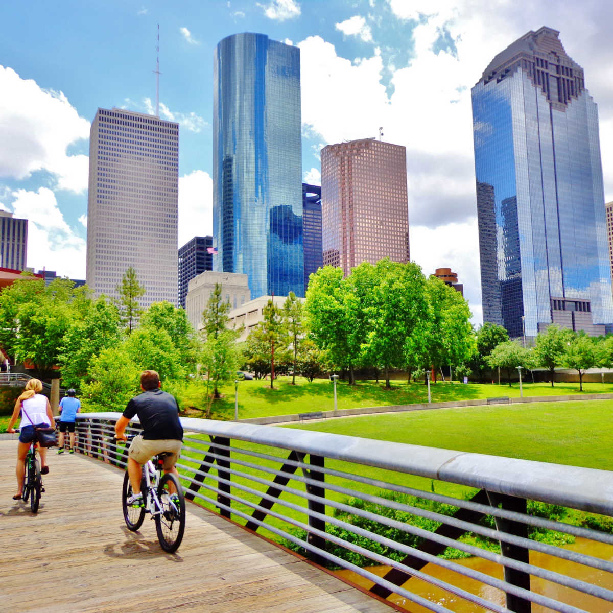 Couple riding bike near downtown Houston ,TX