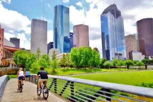 Couple riding bike near downtown Houston, TX