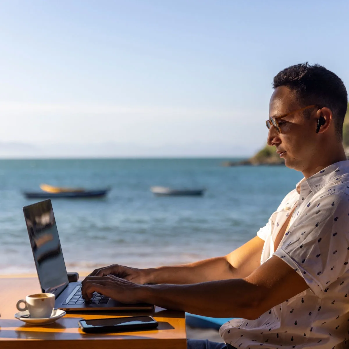Digital nomad in beach cafe