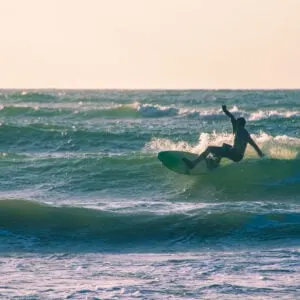 Surfer a JP Luby Beach in Corpus Christi