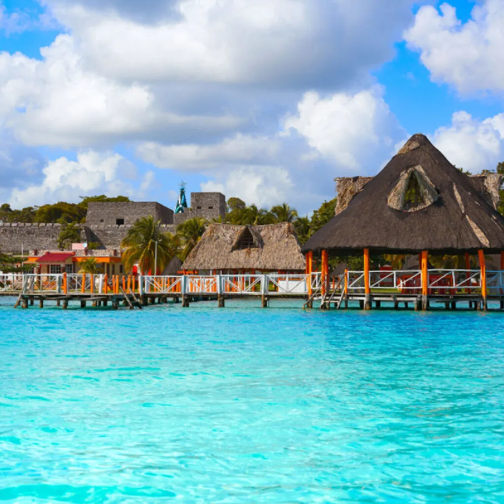 Thatched-roof-palapas-along-Bacalars-pristine-waters